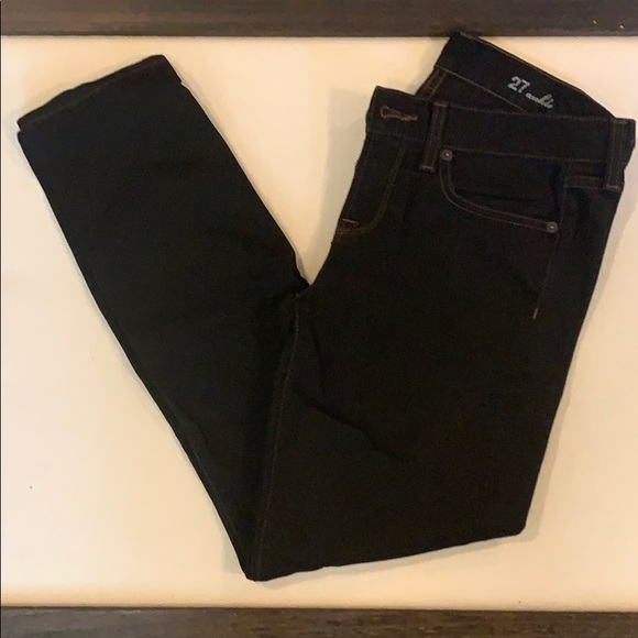 black jeans with orange stitching